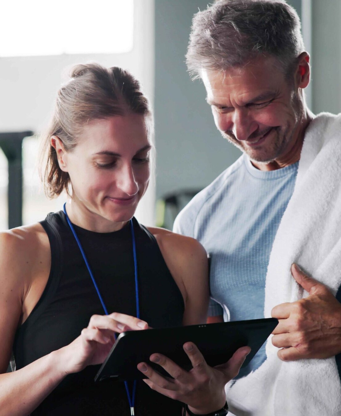 Two people looking at a tablet together
